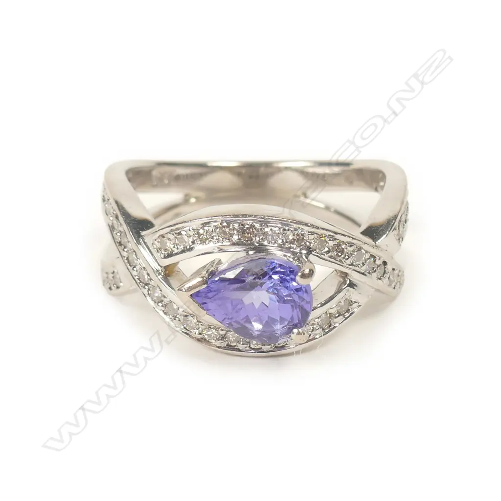 An 18ct white gold tanzanite and diamond ring Image 1++