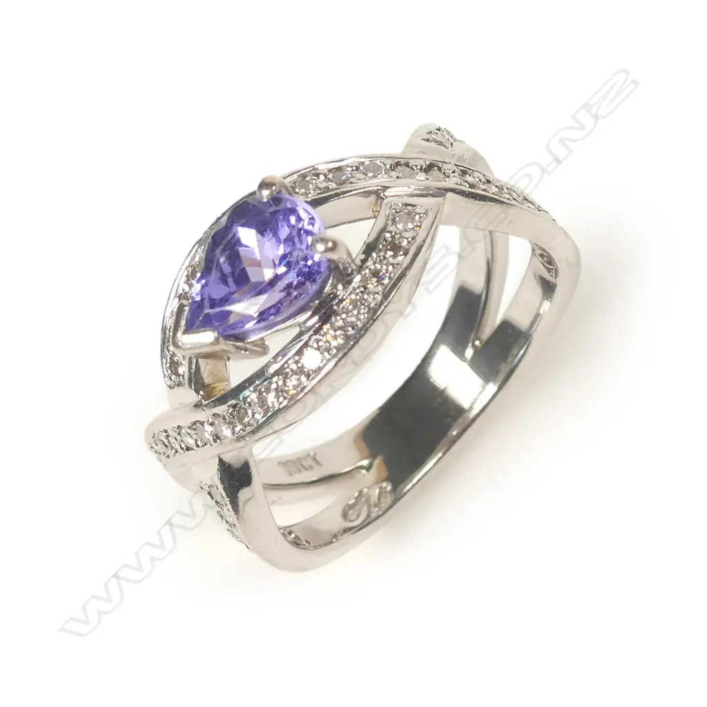An 18ct white gold tanzanite and diamond ring Image 1++