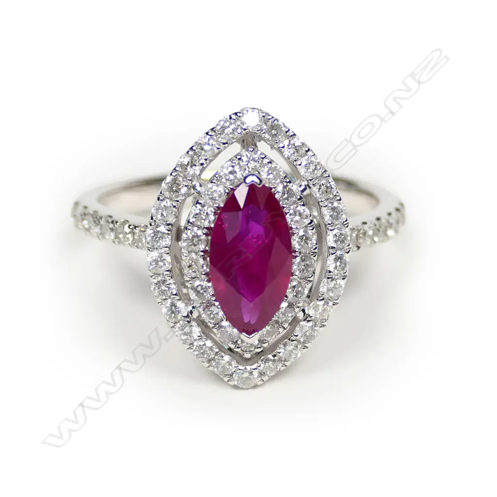 A 14ct white gold ruby and diamond double halo ring Image 1++