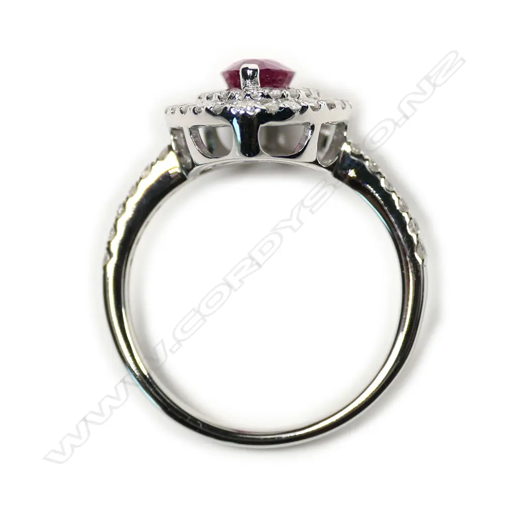 A 14ct white gold ruby and diamond double halo ring Image 1++