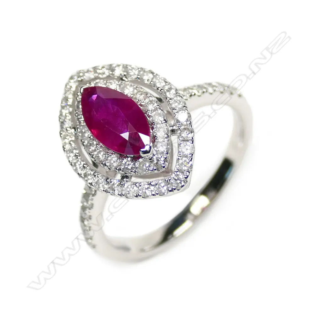 A 14ct white gold ruby and diamond double halo ring Image 1++