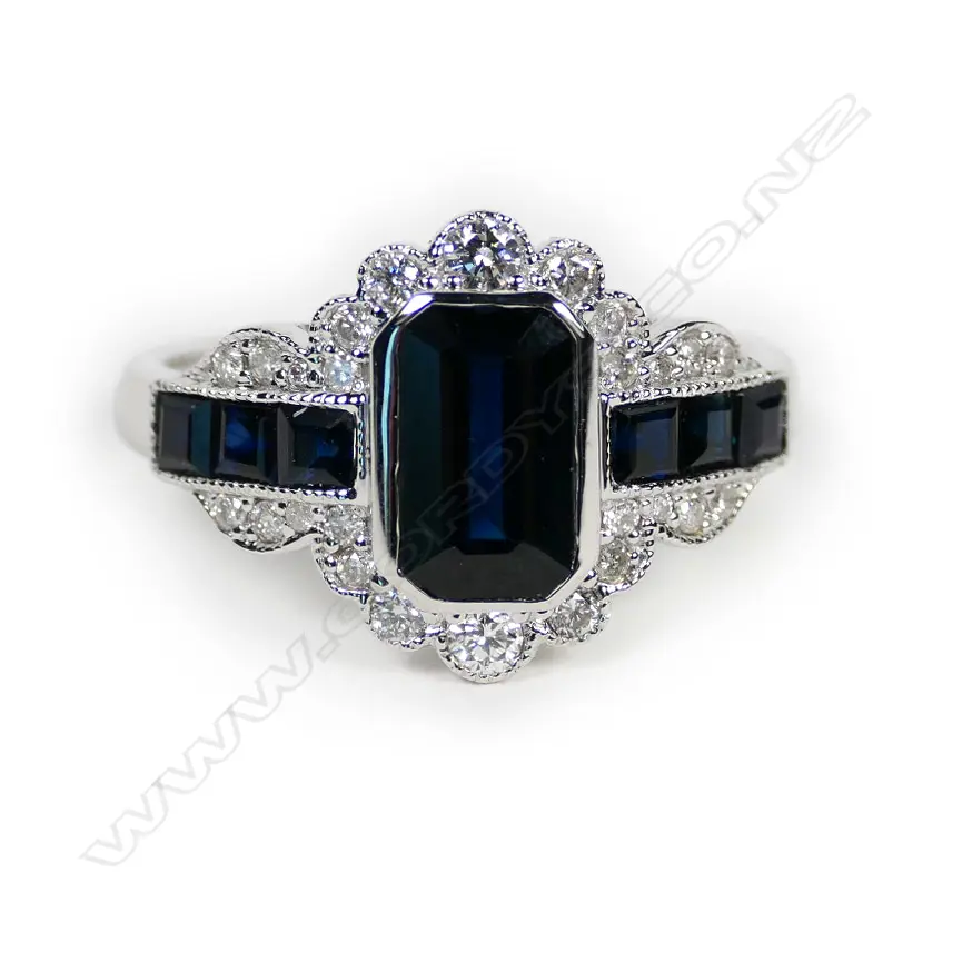 A 14ct white gold sapphire and diamond filigree ring Image 1++