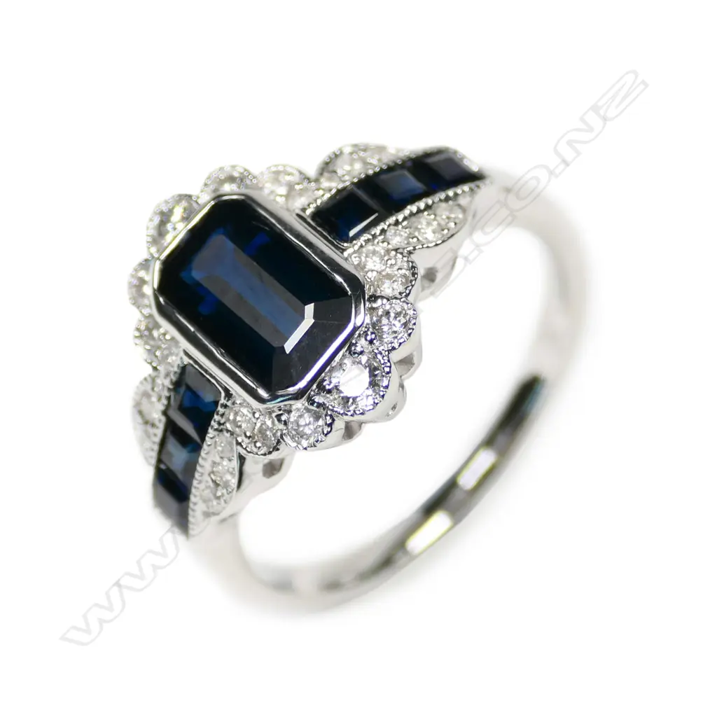 A 14ct white gold sapphire and diamond filigree ring Image 1++