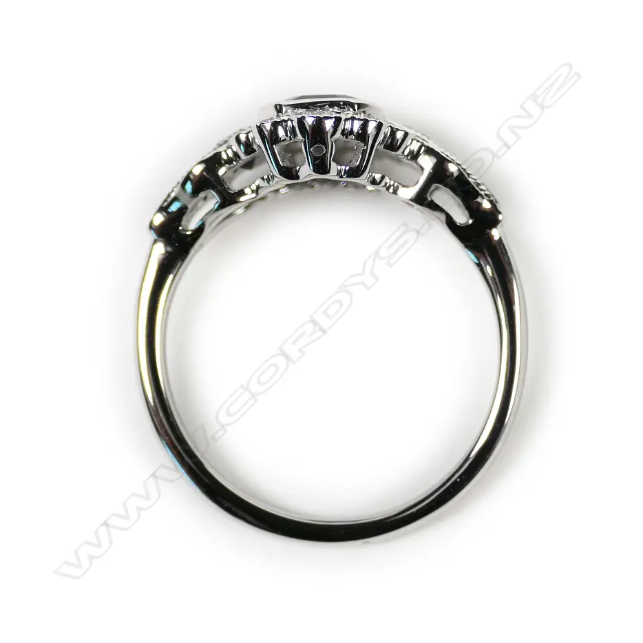 A 14ct white gold sapphire and diamond filigree ring Image 1++