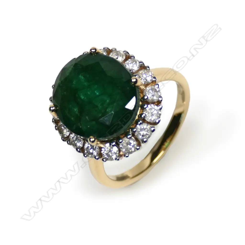 A 14ct gold emerald and diamond ring Image 1++