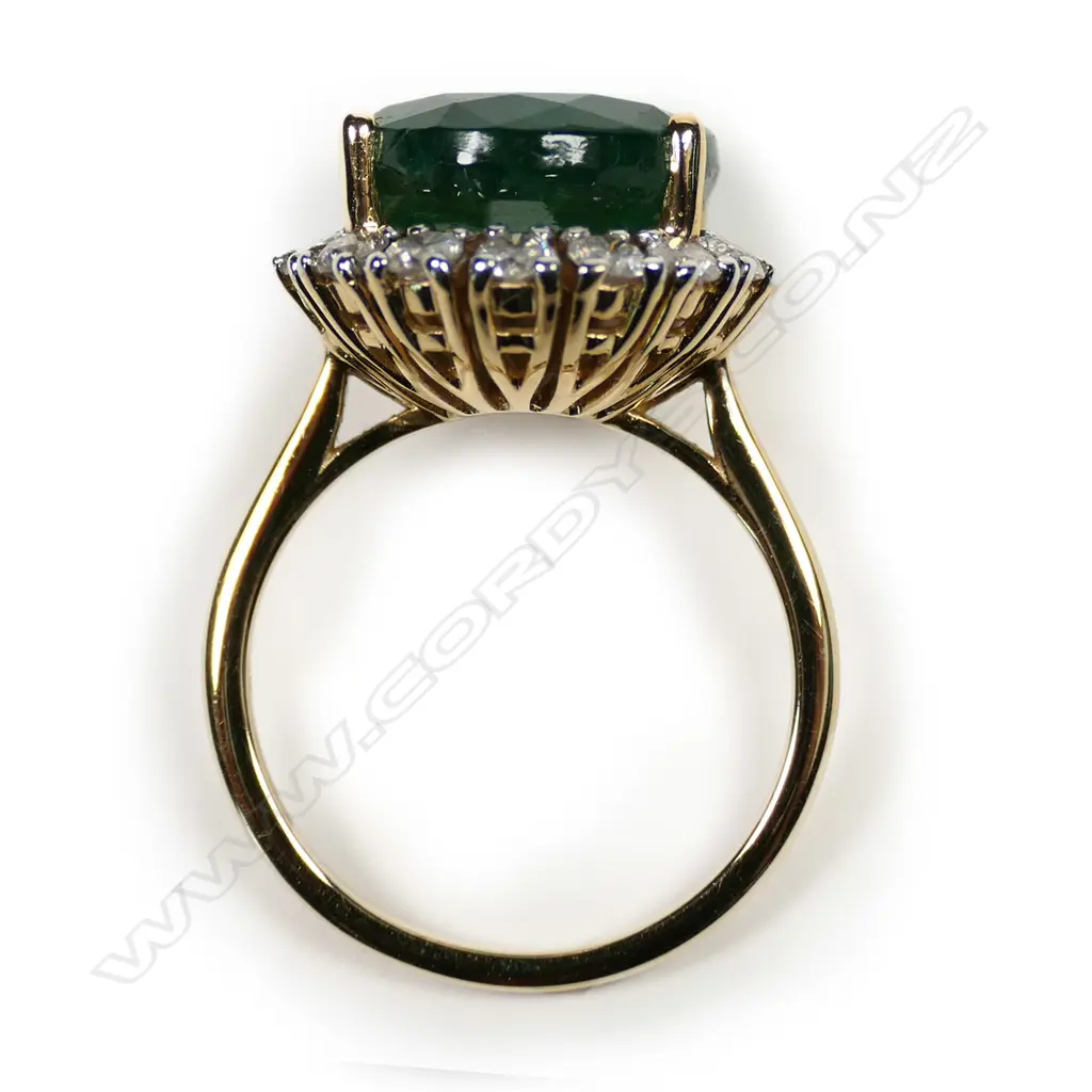 A 14ct gold emerald and diamond ring Image 1++
