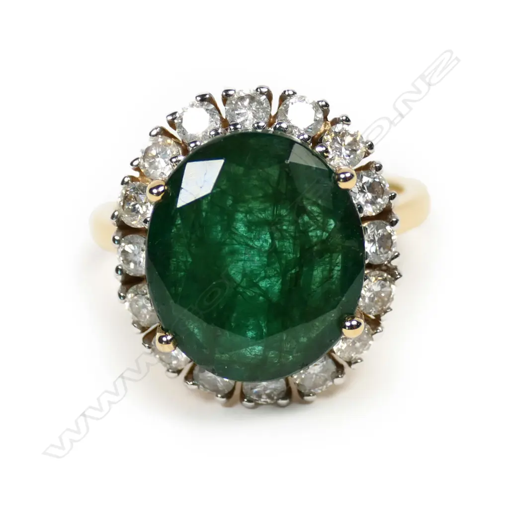 A 14ct gold emerald and diamond ring Image 1++