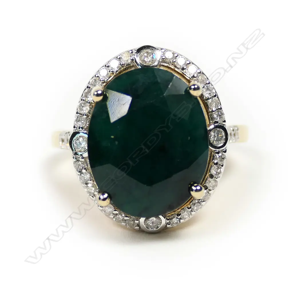 A 14ct gold emerald and diamond ring Image 1++