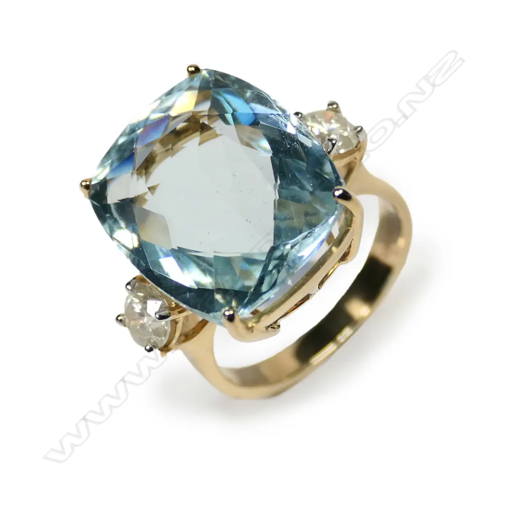 A 14ct gold aquamarine and diamond ring Image 1++