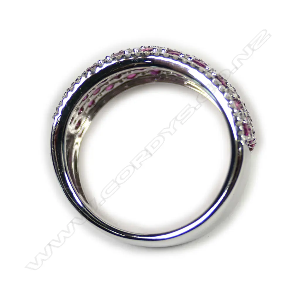 A 14ct white gold ruby and diamond cluster ring Image 1++