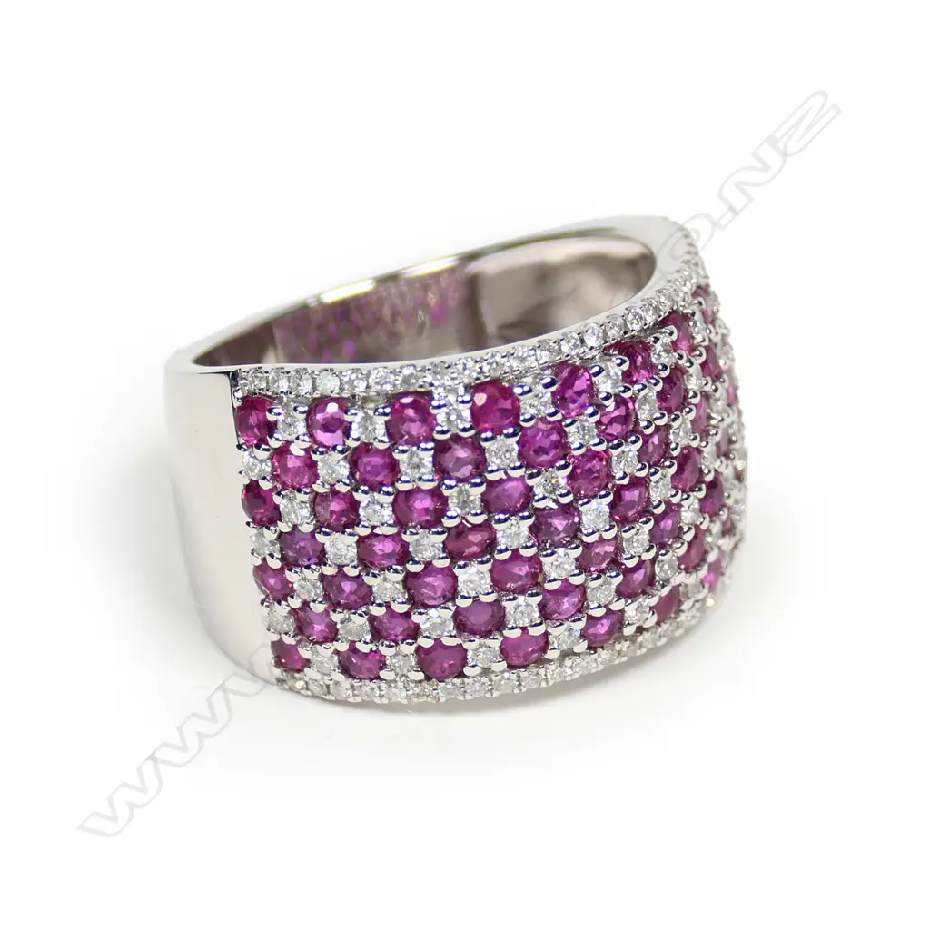 A 14ct white gold ruby and diamond cluster ring Image 1++