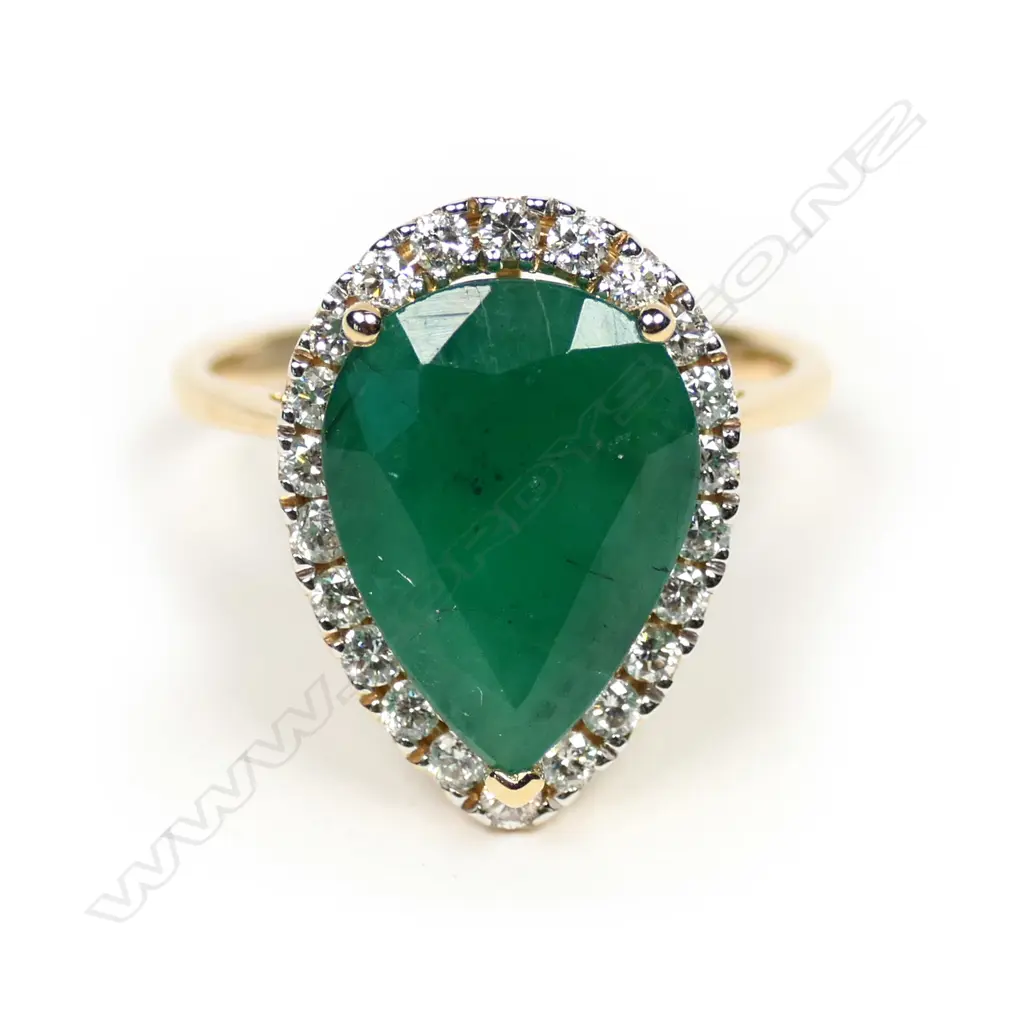 A 14ct gold emerald and diamond ring Image 1++