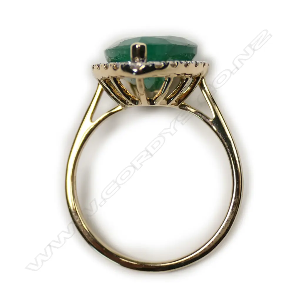 A 14ct gold emerald and diamond ring Image 1++