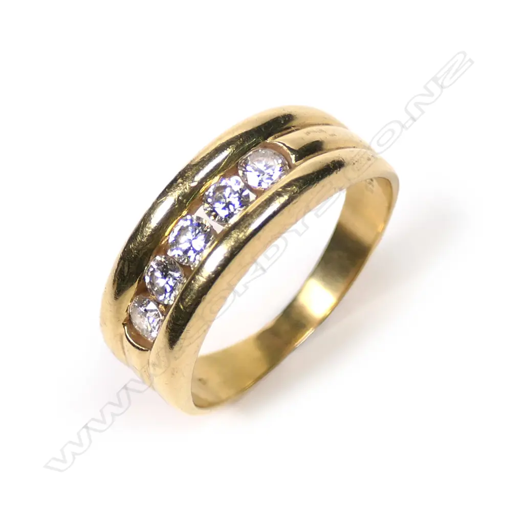 An 18ct gold and diamond band Image 1++
