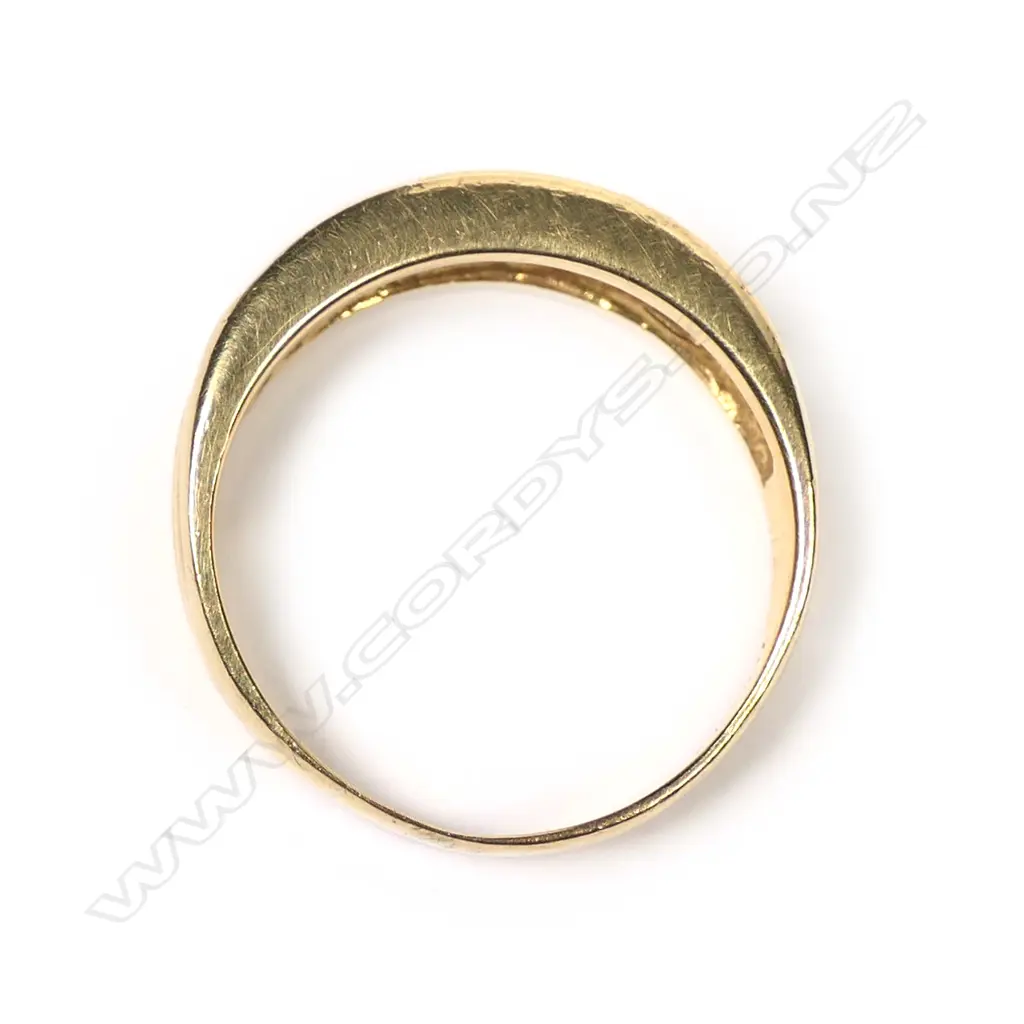 An 18ct gold and diamond band Image 1++