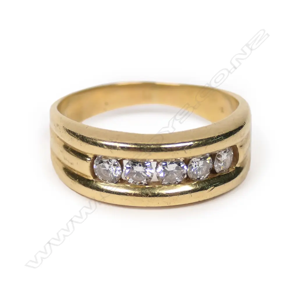 An 18ct gold and diamond band Image 1++