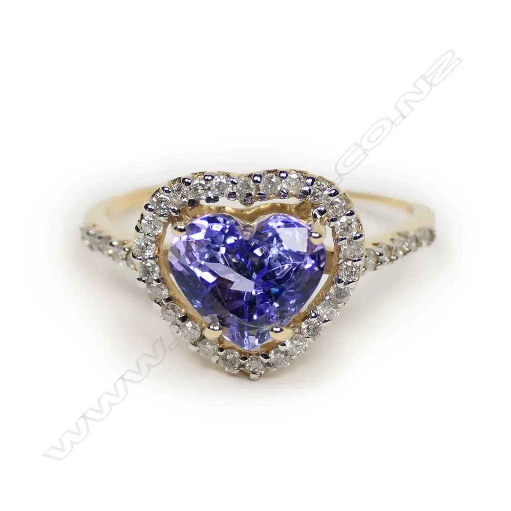 A 14ct gold tanzanite and diamond halo heart ring Image 1++
