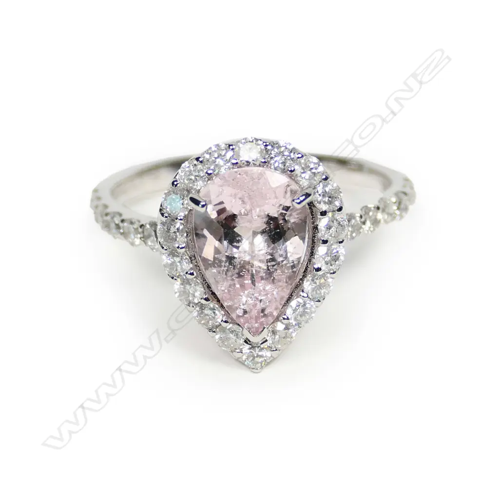 A 14ct white gold morganite and diamond halo ring Image 1++