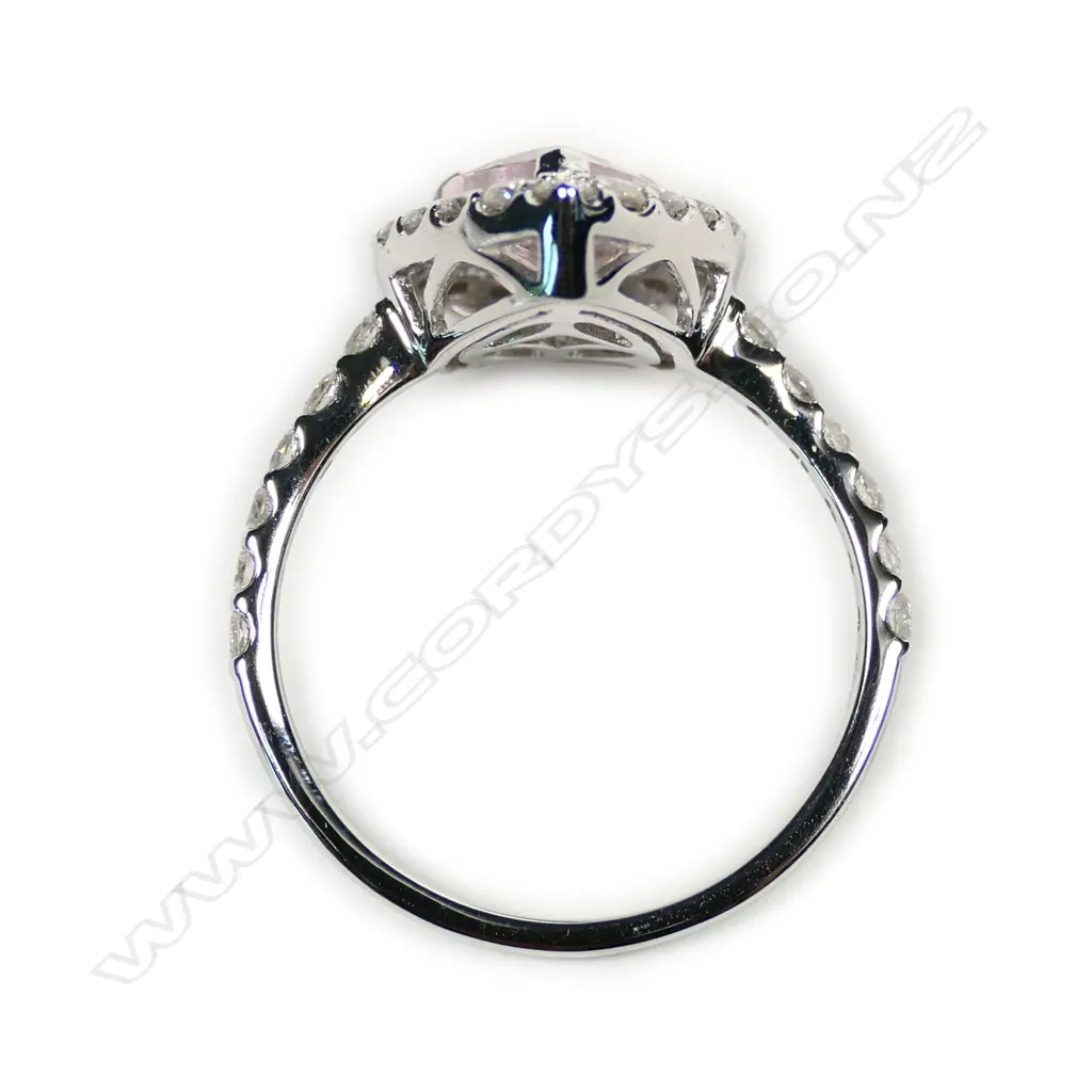 A 14ct white gold morganite and diamond halo ring Image 1++