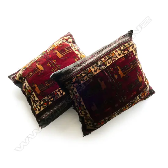 A pair of Afghan rug cushions