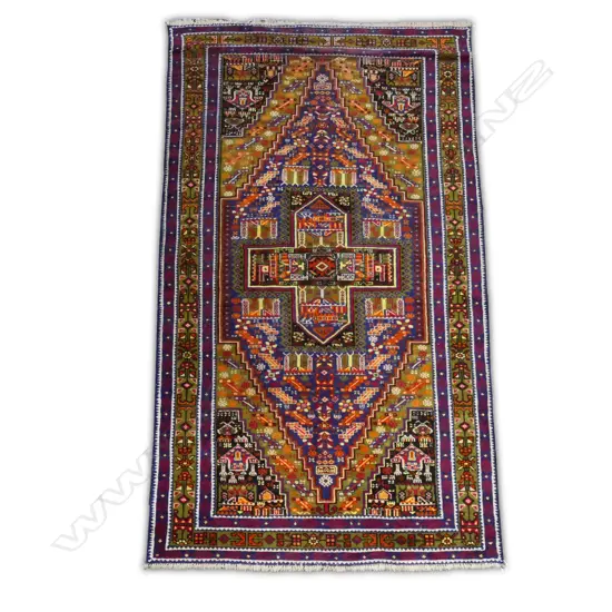 A hand knotted Baluchi rug