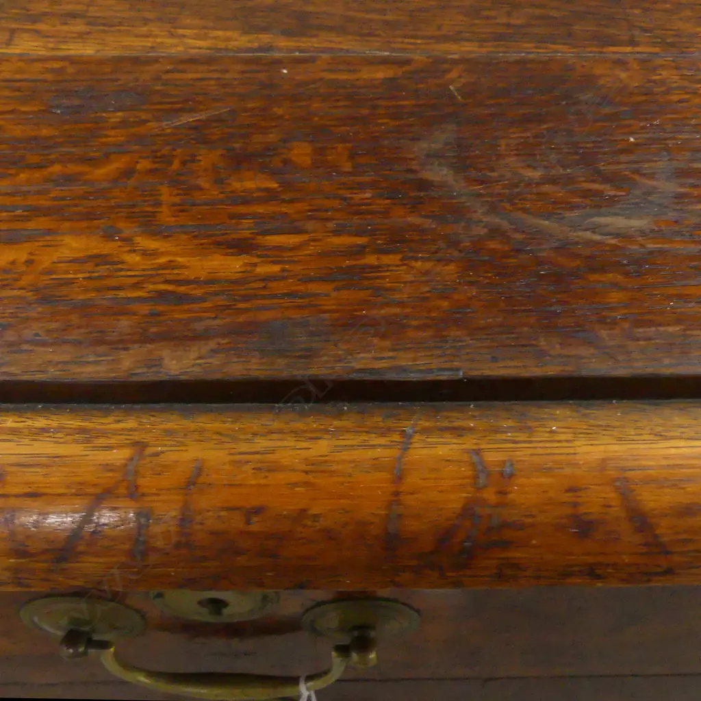 An unusually small-proportioned chest of four drawers Image 1++