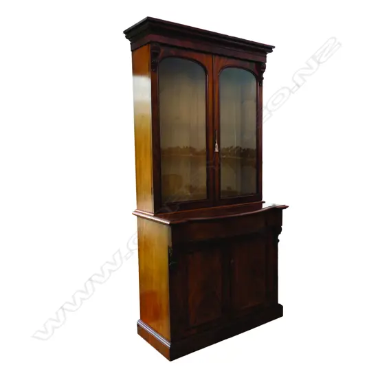 A Victorian flame mahogany bookcase cabinet