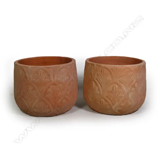 A pair of terracotta French style garden pots