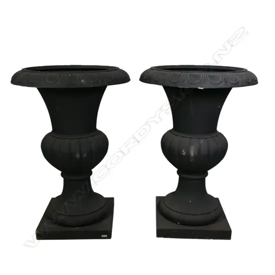 A pair of large and impressive classical style garden urns