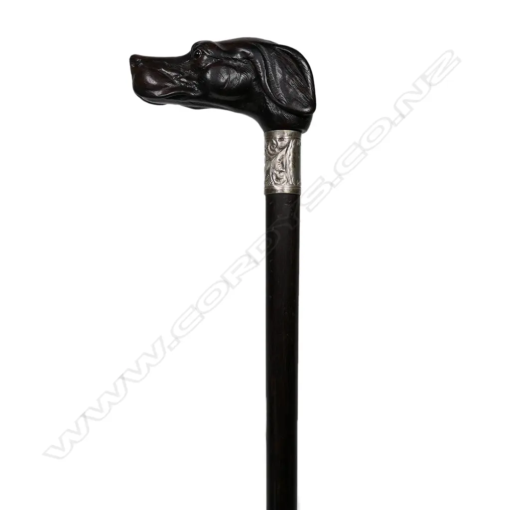 A vintage carved dog head handled walking cane Image 1++