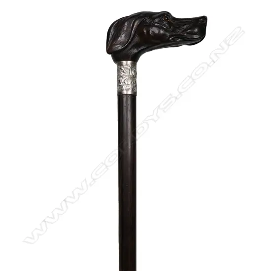 A vintage carved dog head handled walking cane