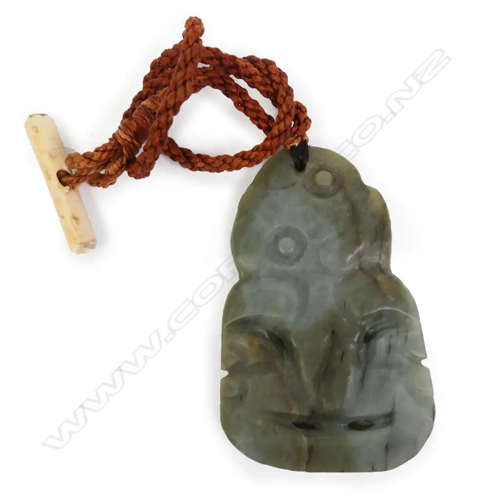 A contemporary stone tooled pounamu hei tiki by Matiu Bartlett Image 1++