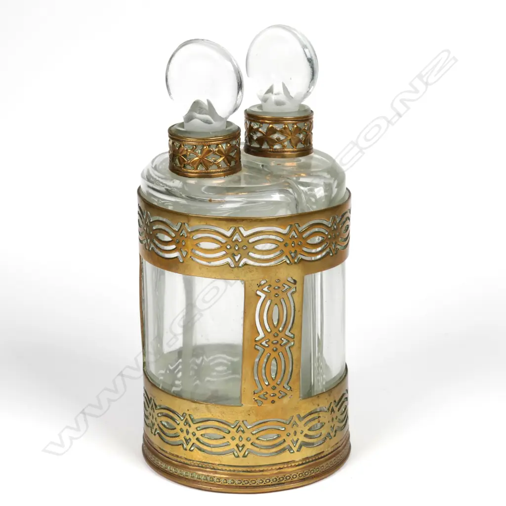 A pair of early 1900s glass perfume bottles in brass holder Image 1++