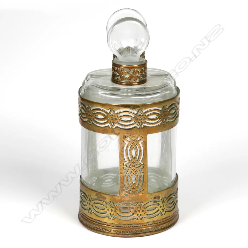 A pair of early 1900s glass perfume bottles in brass holder Image 1++