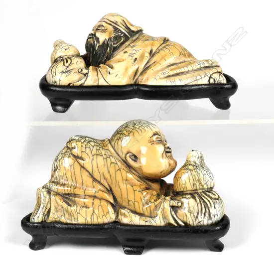 A pair of carved mammoth ivory figures