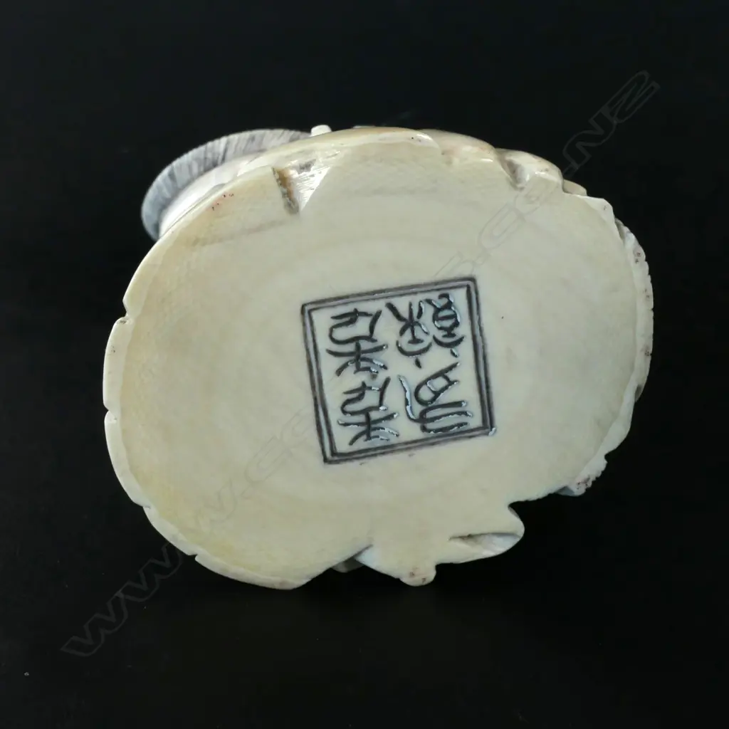 A Chinese carved ivory fisherman on stand Image 1++