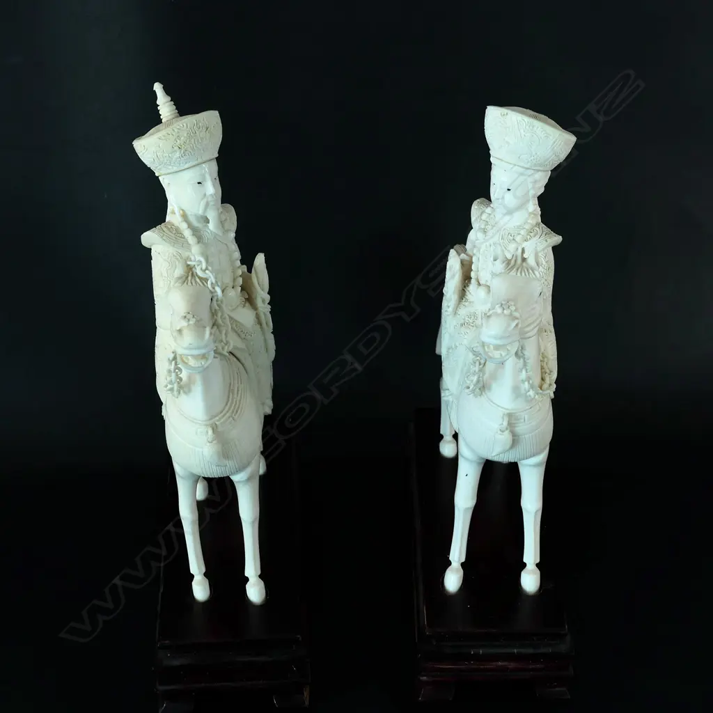 A pair of Chinese carved ivory Emperor and Empress figures on horseback Image 1++