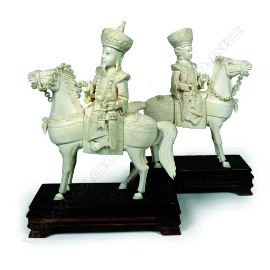 A pair of Chinese carved ivory Emperor and Empress figures on horseback
