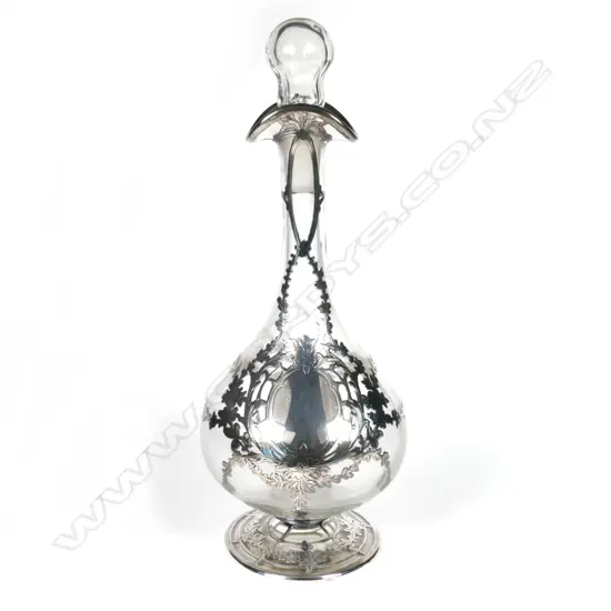An Edwardian silver and glass 'Eau de Toilette' bottle