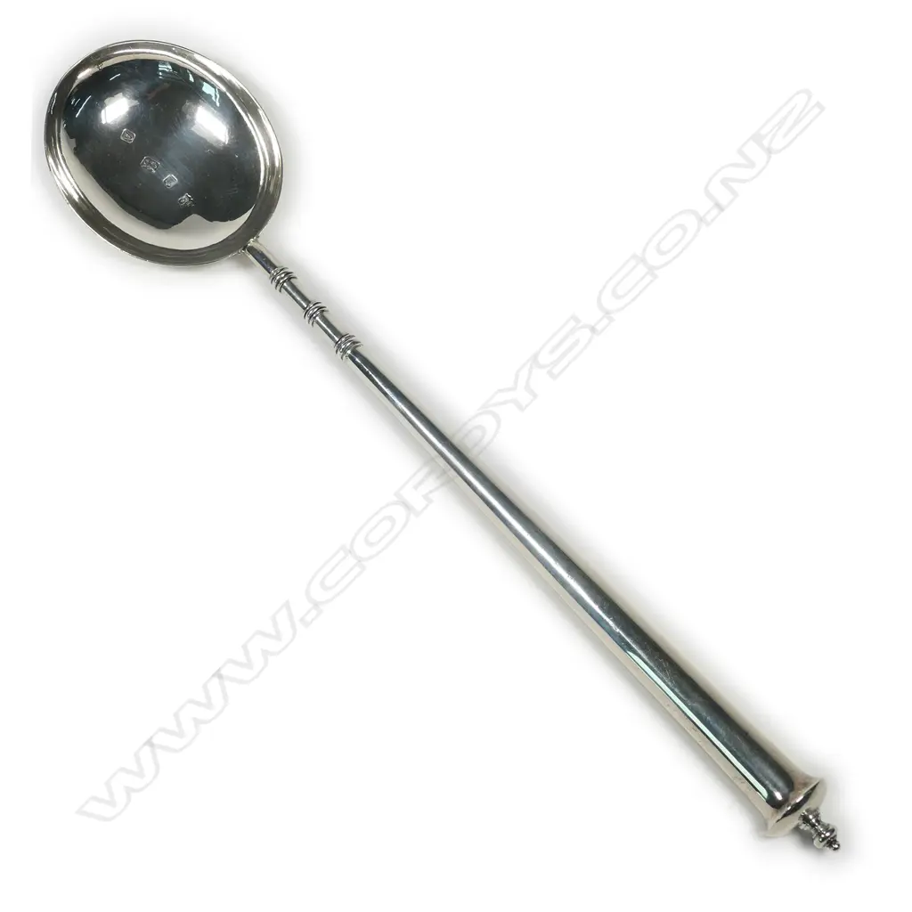 An impressive silver serving spoon Image 1++