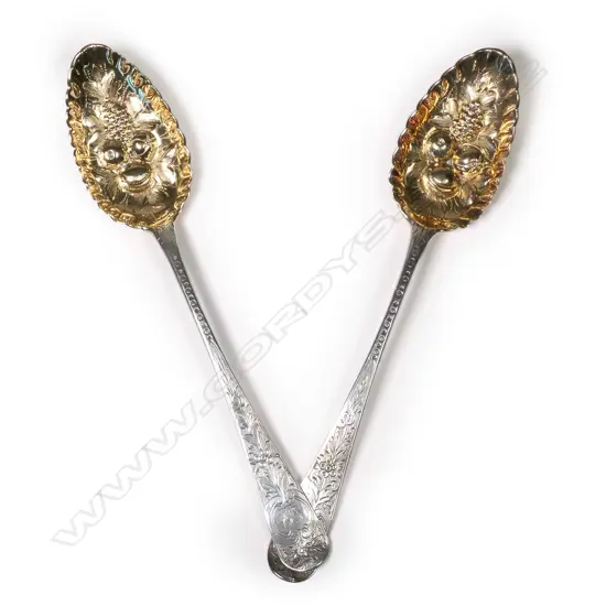 A pair of George III silver berry spoons