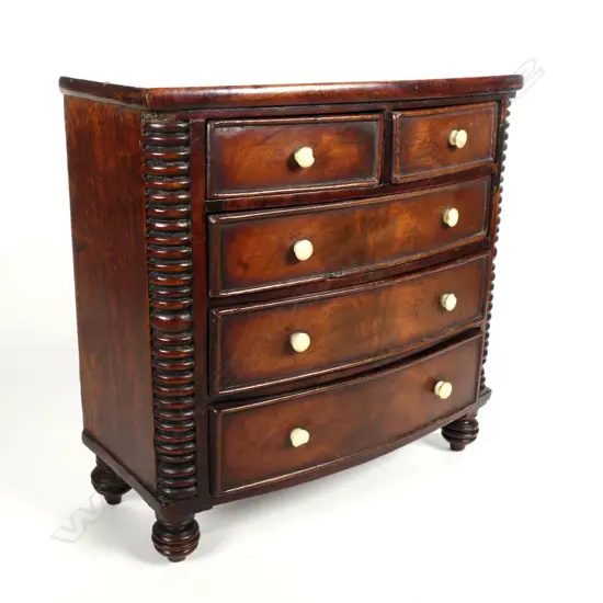 A Georgian mahogany miniature bowfront chest of drawers