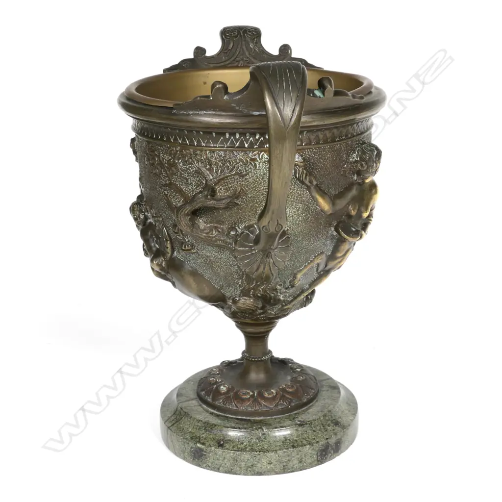 A bronze two-handled urn Image 1++