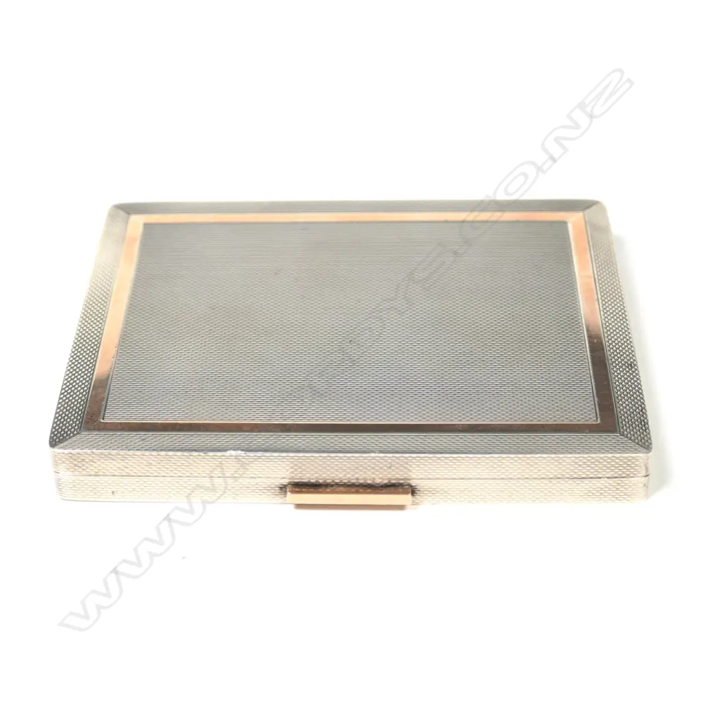 A silver and gold Dunhill cigarette case Image 1++
