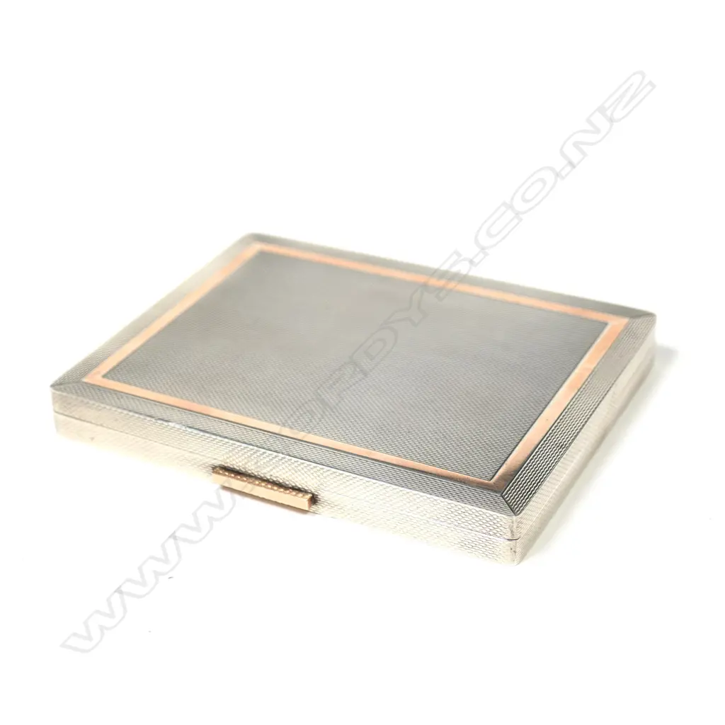 A silver and gold Dunhill cigarette case Image 1++