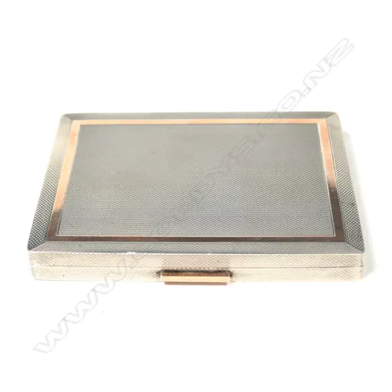 A silver and gold Dunhill cigarette case