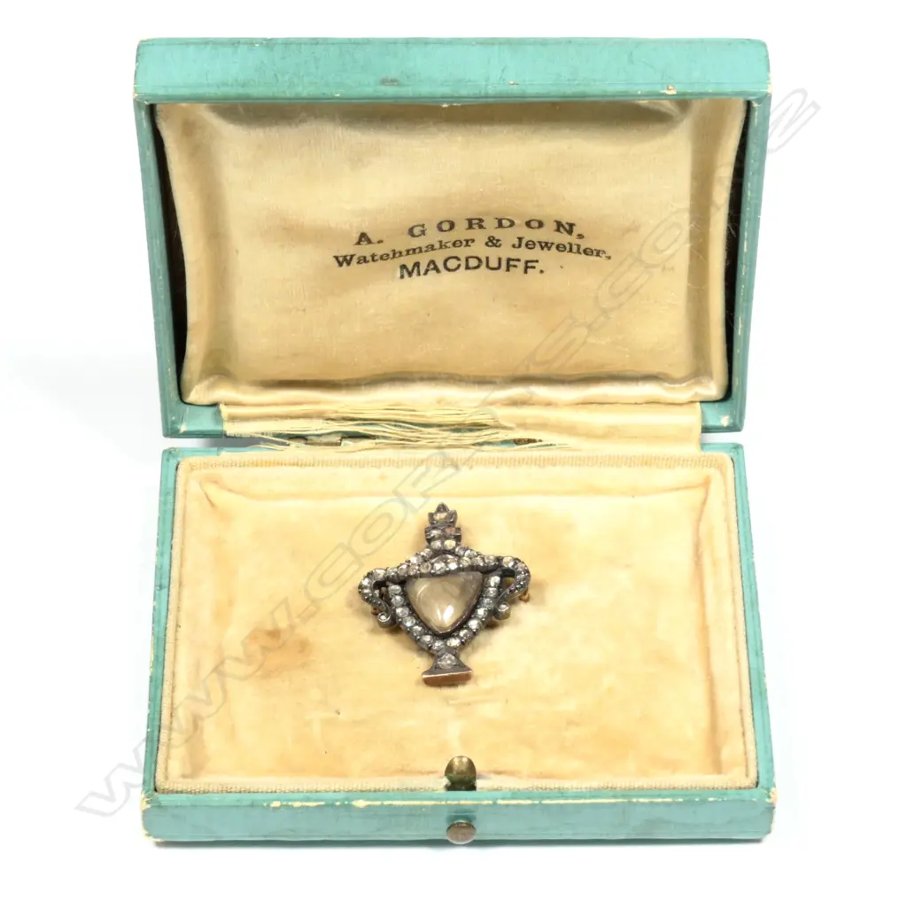 A Georgian silver gilt diamond and rock crystal mourning brooch Image 1++