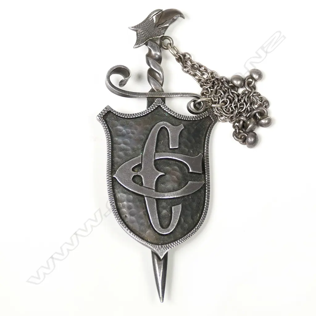 A Tony Buller 'Patoni' silver sword and shield brooch Image 1++