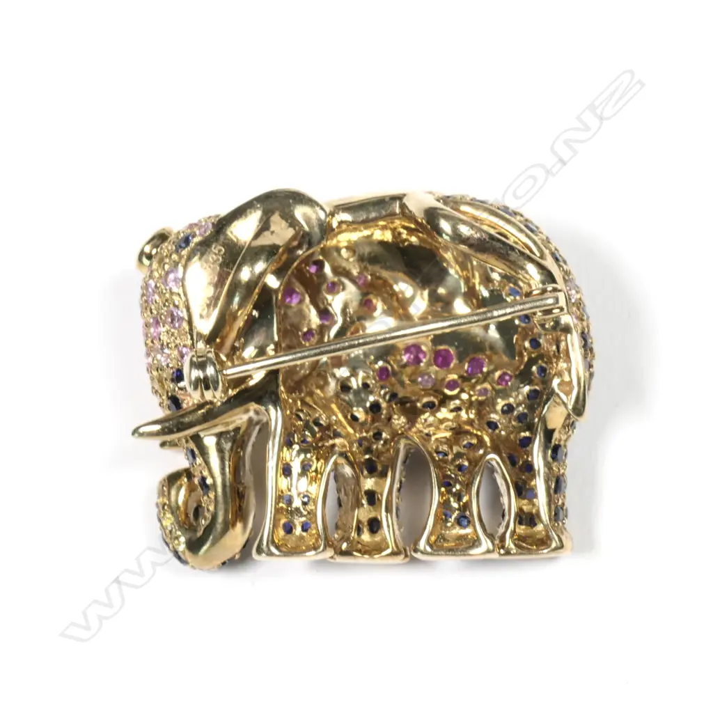 A 9ct yellow gold diamond ruby and sapphire set elephant pendant / brooch Image 1++