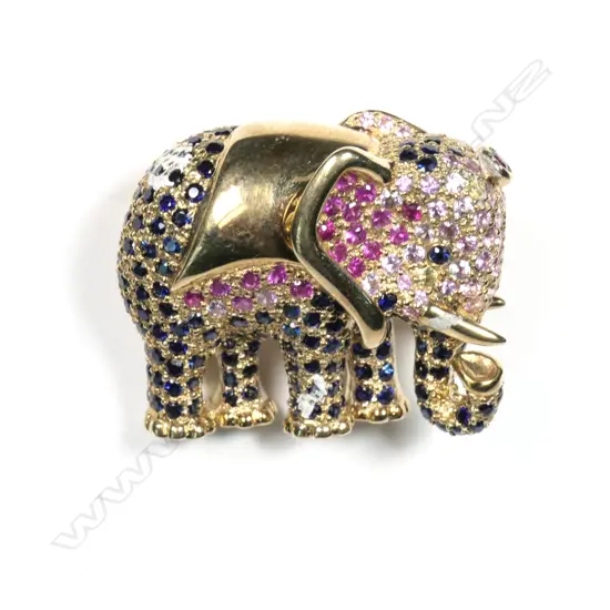 A 9ct yellow gold diamond ruby and sapphire set elephant pendant / brooch